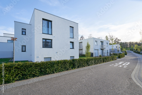 Fotomural A street with new residential buildings and a speed limit of 30 kilometers or mi