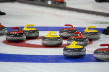 Curling Rock On The Ice	