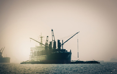 ship in the sea at sunset