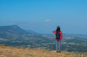 Retired woman Happy to travel on high hills.