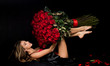 Beauty romantic woman with Red Rose flowers. Valentine. Fashion studio portrait of beautiful girl. Gift with love. Favorite flowers.