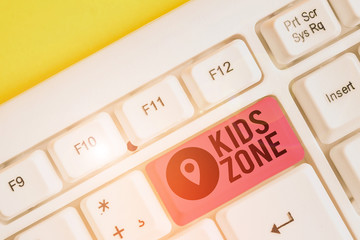 Poster - Writing note showing Kids Zone. Business concept for An area or a region designed to enable children to play and enjoy White pc keyboard with note paper above the white background