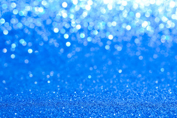 Wall Mural - sparkles of blue glitter abstract background	