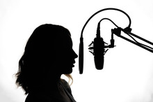 Silhouette Of A Girl With A Studio Microphone, Radio Presenter, Singer And Blogger, Voice Acting For Films. Strong, Black And White Photo