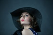 © константин константи - girl in a blue evening dress and a black hat