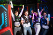 © JackF - Young people with laser guns on lasertag arena