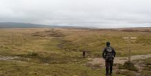 A Walker Looking Out Towards Pen-y-ghent In The Yorkshire Dales