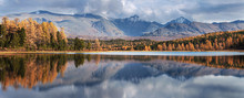Picturesque Lake In The Mountains Of Altai. Autumn Day. Forested Shores,  Reflection In Water.
