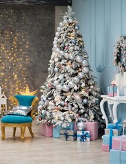 Christmas tree with blue and pink gifts in the white room Christmas. Beautifully decorated house with a silver, pink and blue tree and presents at Christmas.