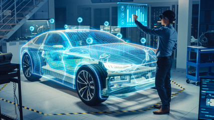 Fototapete - Automotive Engineer Use Virtual Reality Headset for Virtual Electric Car 3D Model Design Analysis and Improvement. 3D Graphics Visualization Shows Fully Developed Vehicle Prototype Analysed Optimized