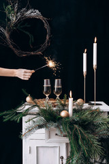 Female hand holds a burning sparkler