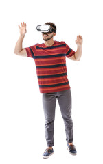 Wall Mural - Young man with virtual reality glasses on white background