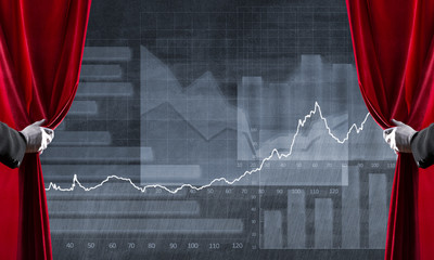 Graphs and diagrams behind drapery curtain and hand opening it