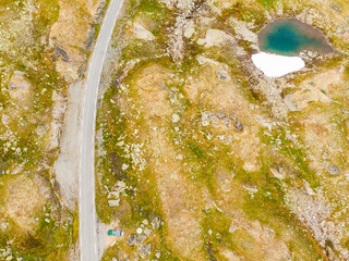 Wall Mural - Camper car in mountains on roadside, Norway