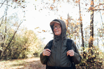 Canvas Print - Senior man hiking on a mountain.