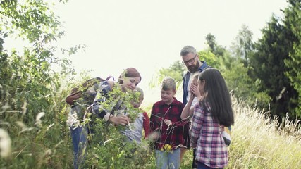 Poster - Group of school children with teacher on field trip in nature, learning science.