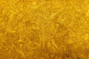 orange decorative plaster background, ginger stucco wall with copyspace, abstract wallpaper close up ,yellow texture macro