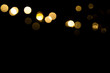 Abstract gold bokeh with black background