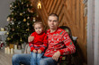 © combo1982 - Happy man with son in a New Year's decor. Happy Merry Christmas 2020.