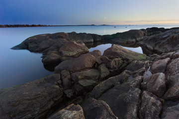 sunset on rocky shore of the baltic sea