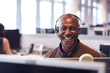 © Monkey Business - Portrait Of Mature Businessman Wearing Telephone Headset Working In Customer Services Department