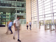 © Monkey Business - Motion Blur Shot Of Businesspeople In Lobby Of Busy Modern Office