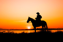 Cowboy On Horse With Sunset Landscape 