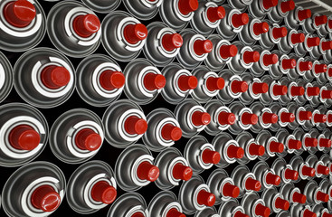 many red lids on iron cans