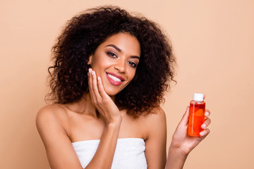 Wall Mural - Close-up portrait of her she nice-looking attractive well-groomed cheerful wavy-haired girl using oil mask balsam balm organic detox vitamin isolated over beige pastel background