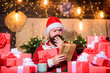 © be free - Buy christmas presents. December purchases. Old tradition. Santa Claus routine. Preparing gifts. Man Santa hat preparing for christmas holiday. Merry christmas concept. Winter carnival. Shopping list