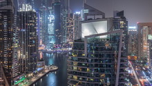 Aerial View Of Dubai Marina Residential And Office Skyscrapers With Waterfront Night Timelapse