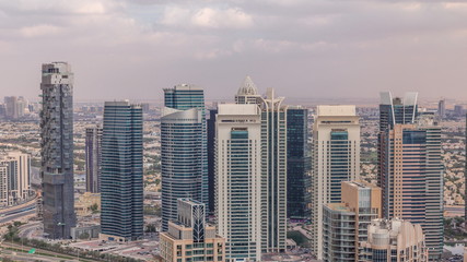  Dubai Marina skyscrapers and jumeirah lake towers view from the top aerial timelapse in the United Arab Emirates.