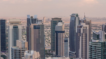  Dubai Marina skyscrapers and jumeirah lake towers view from the top aerial timelapse in the United Arab Emirates.