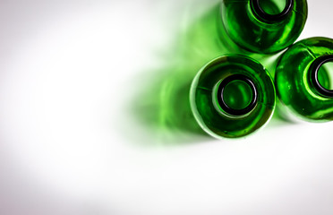 three green beer bottles