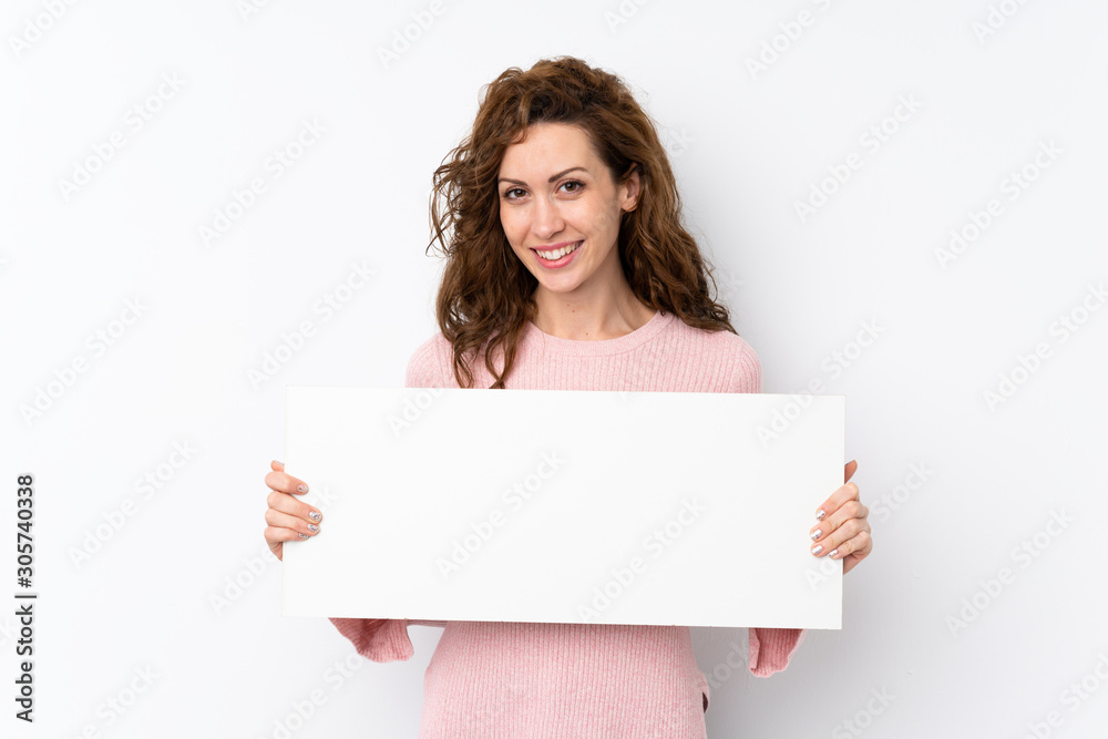 Young pretty woman over isolated background holding an empty white placard for insert a concept - obrazy, fototapety, plakaty 