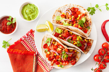 Wall Mural - mexican beef and pork tacos with salsa, guacamole and vegetables