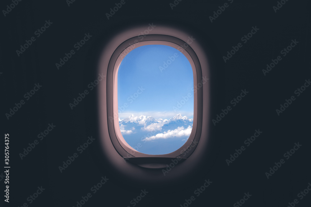 Airplane window. Mountain and clouds view Stock Photo | Adobe Stock