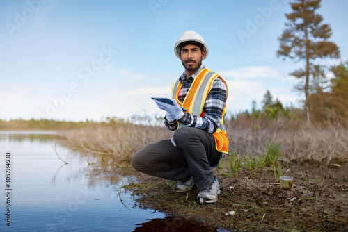 Cuadros en Lienzo Marine biologist analysing water test results on a tablet in Can