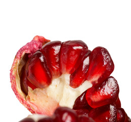 Wall Mural - Pomegranate seeds close-up isoilrvoano on a white background