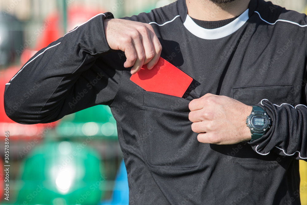 Referee Issuing Red Card Football referee showing the red card. Stock Photo | Adobe Stock