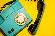 Blue Retro Telephone On The Yellow Background With A Copyspace For A Text