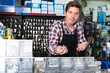 © JackF - Worker man in hardware store is trading goods for construction