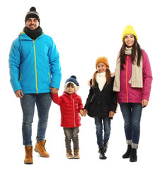 Canvas Print - Happy family in warm clothes on white background. Winter vacation