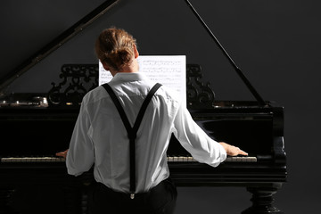 Man playing grand piano at the concert