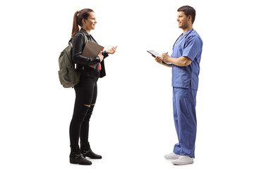 Medical person and a female student talking