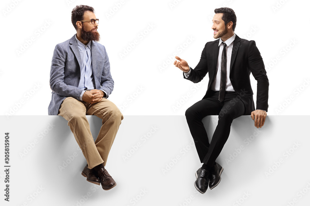 Two men sitting on a panel and having a conversation - obrazy, fototapety, plakaty 