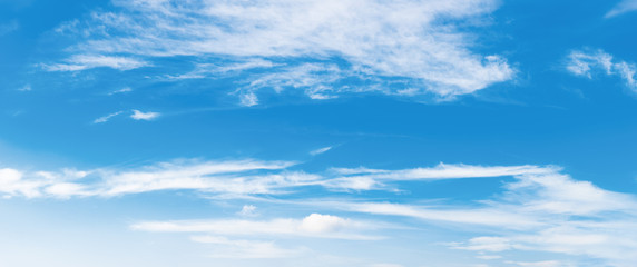 Wall Mural - azure sky panorama with puffy clouds. beautiful springtime nature background. dynamic side lit cloud