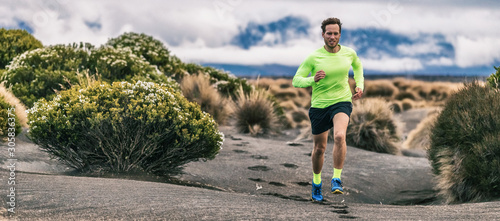 Fotomural Trail run man athlete runner running marathon in desert landscape mountain hills summer background