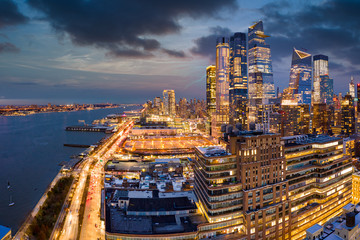Fototapete - Aerial panorama of New York City skyscrapers at dusk as seen from above the 12th avenue and 26th street, close to Hudson Yards and Chelsea neighborhood