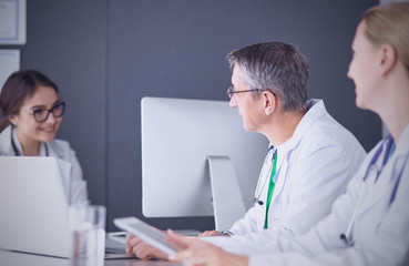 Wall Mural - Doctors having a medical discussion in a meeting room